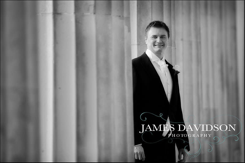 groom at a wedding at Stoke park club