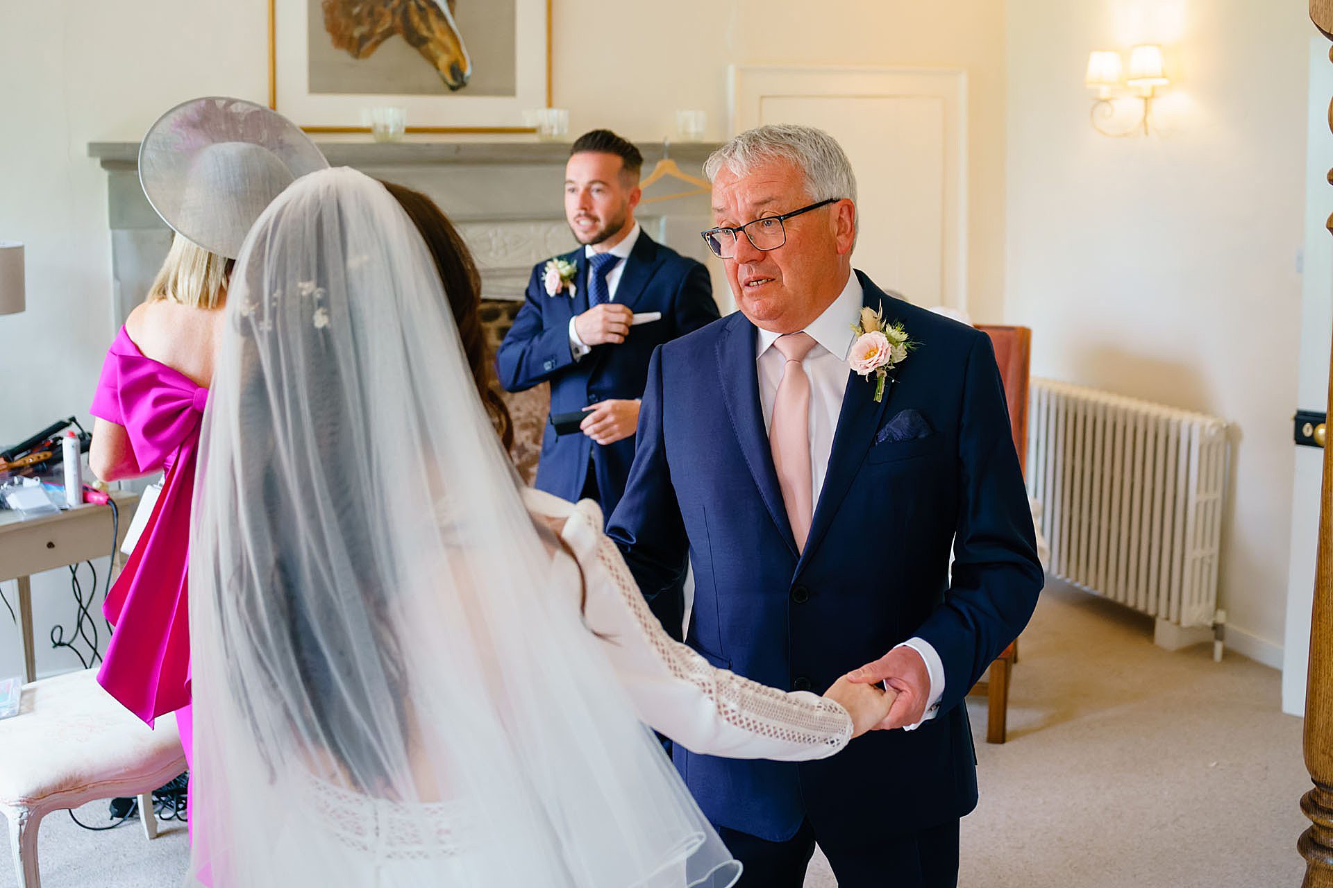 intense first look by father of the bride seeing his daughter for the first time