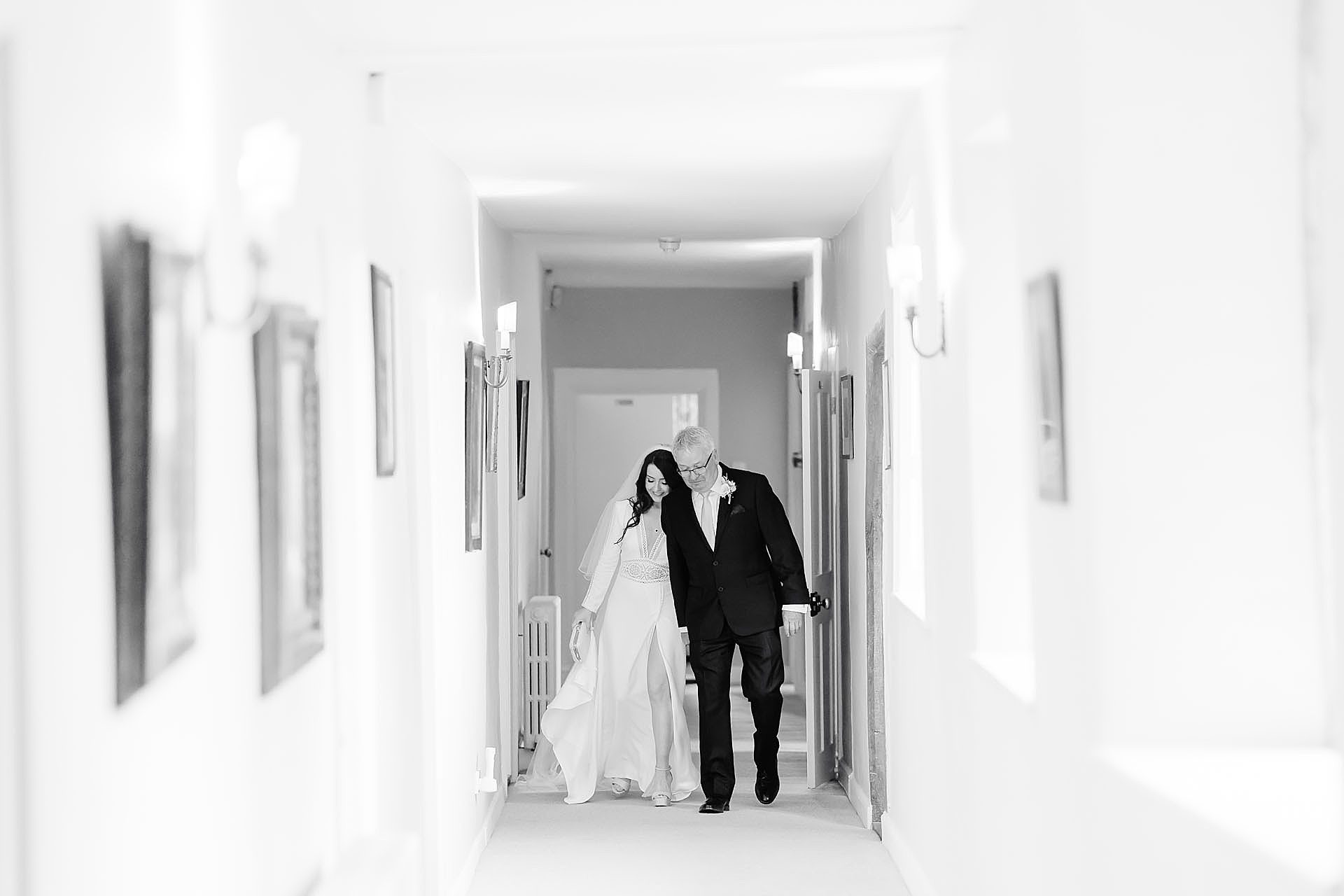 emotional moment with bride walking through the hall with her father