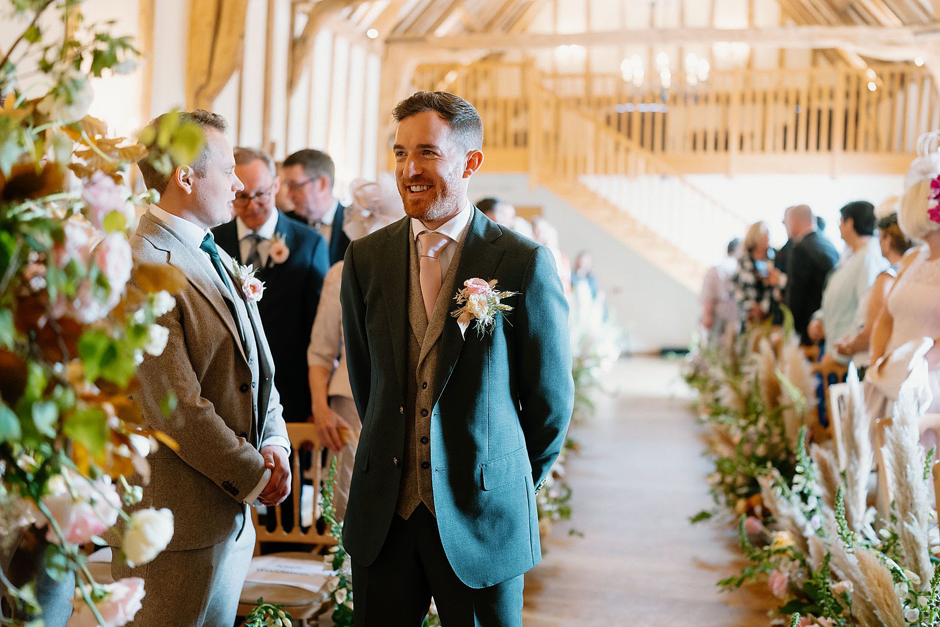 groom waiting for the bride in the barn