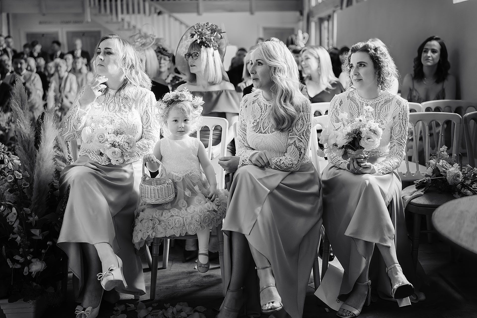 bridesmaids and flower girls during the wedding ceremony