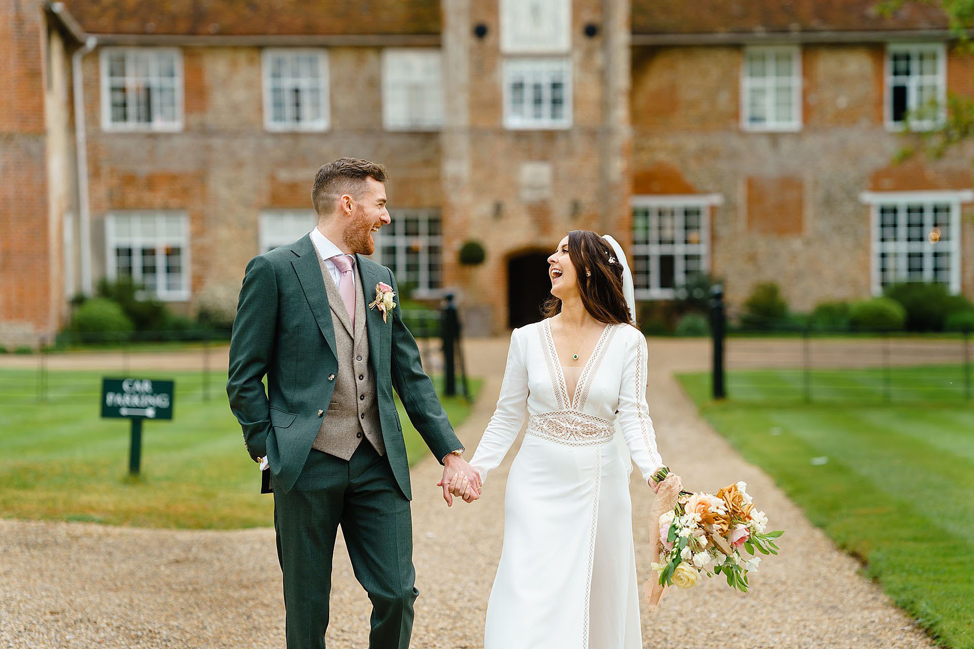 Bride and groom having fun at Bruisyard hall wedding