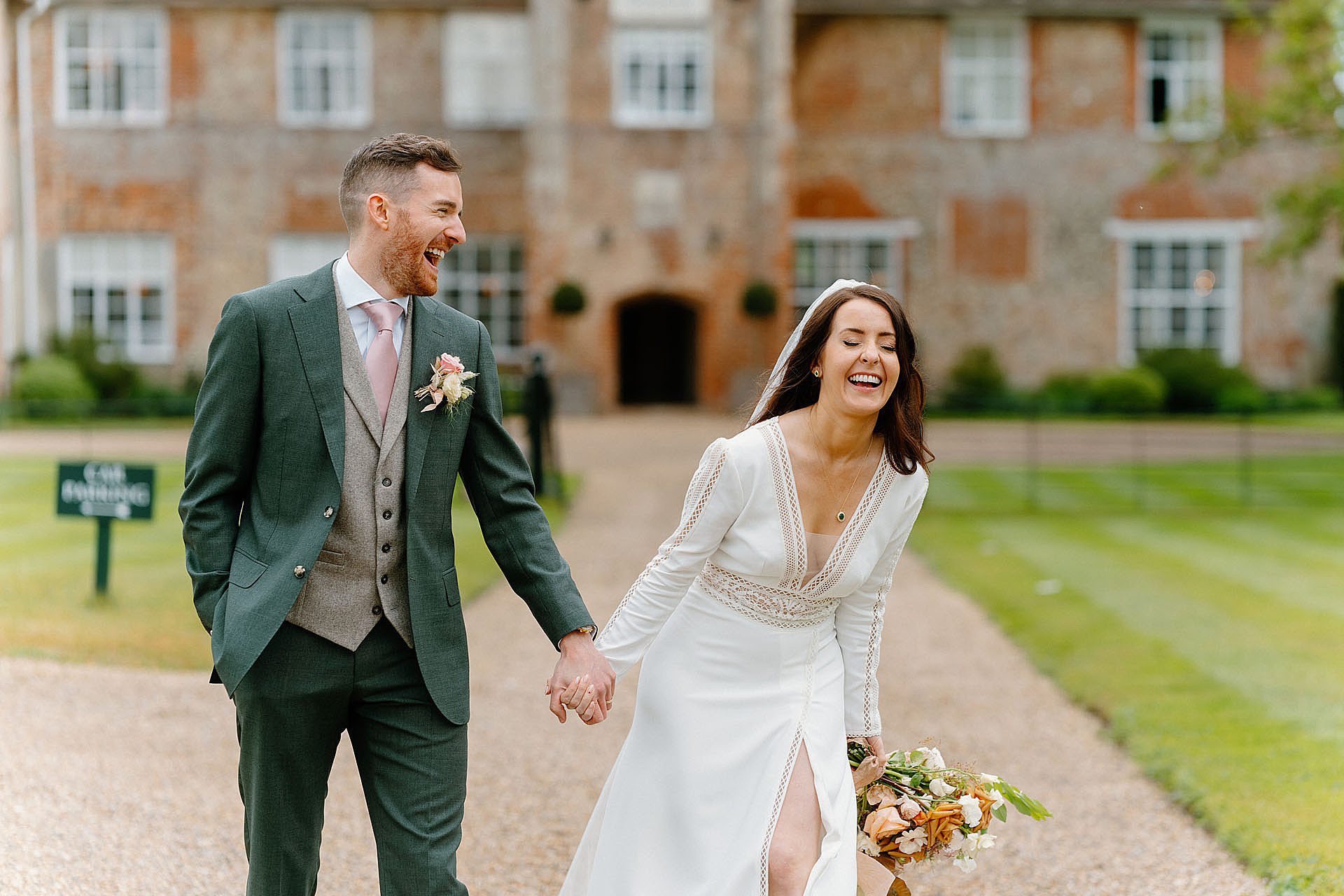Bride and groom having fun at Bruisyard hall wedding