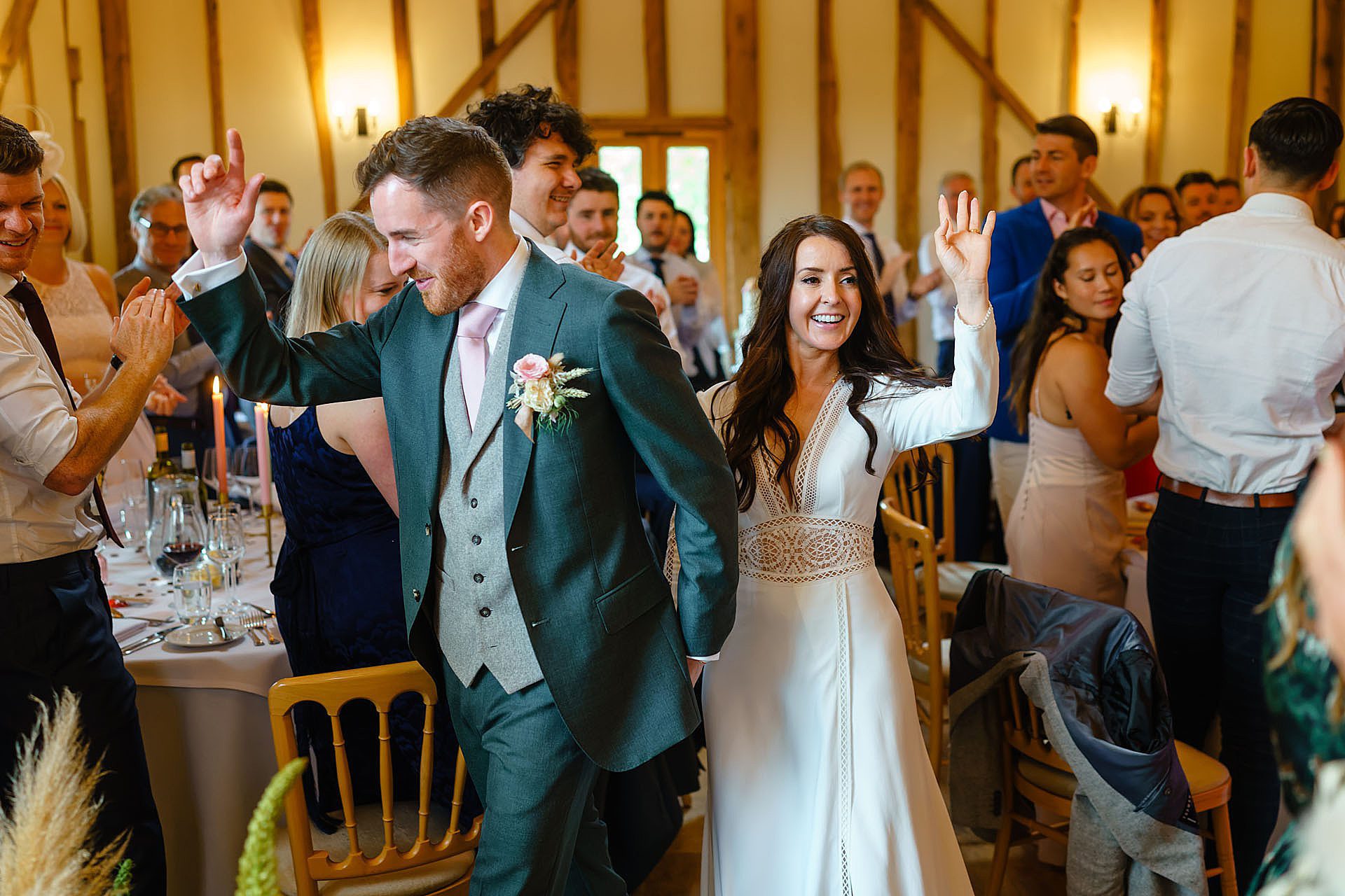 bride and groom cheered into their wedding breakfast
