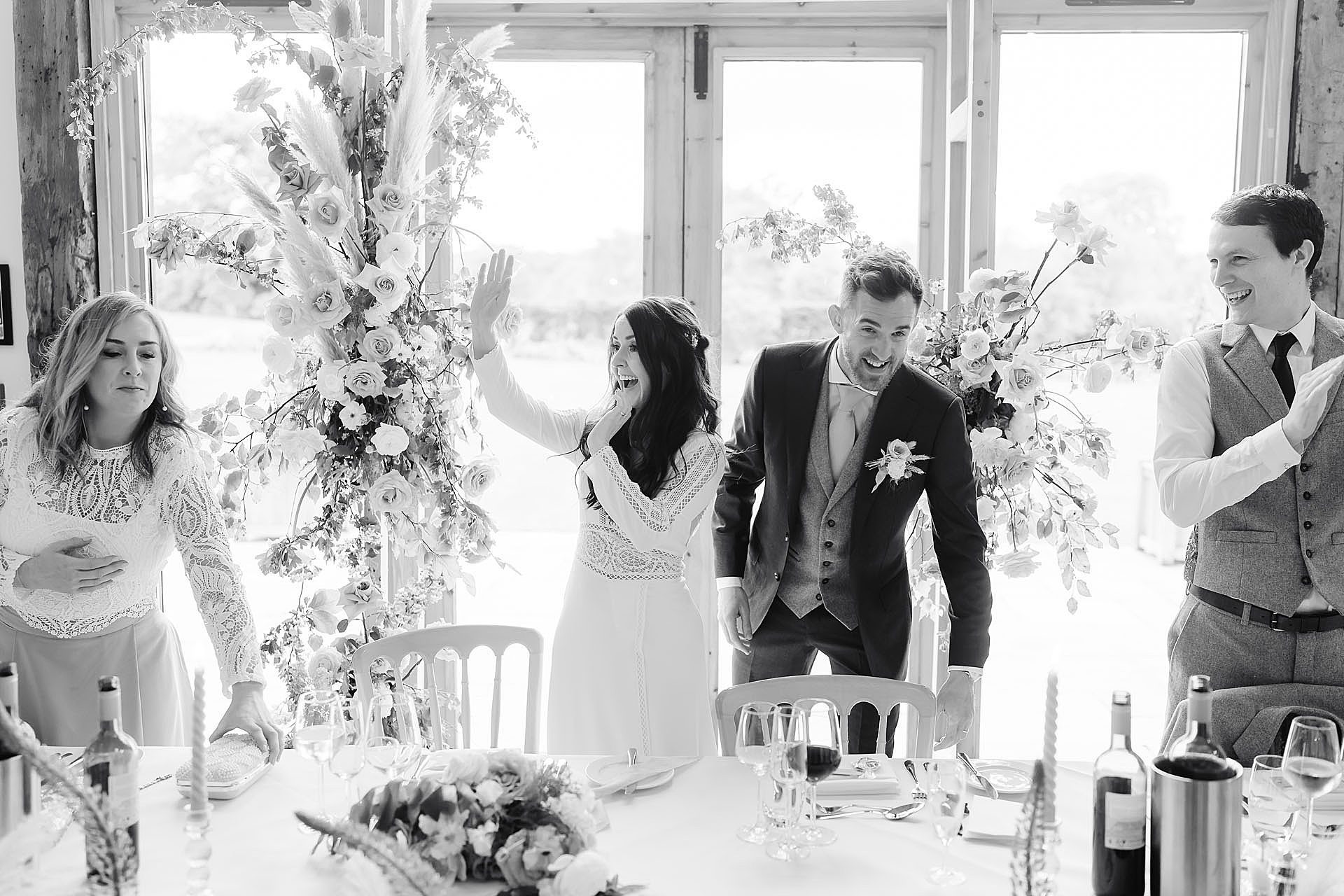 bride and groom cheered into their wedding breakfast